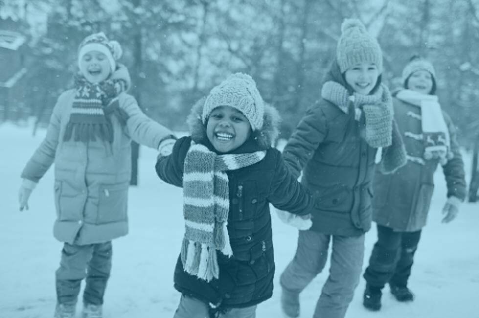Children smiling in the snow
